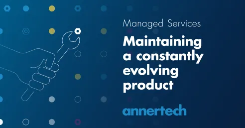 A hand, illustrated in white, tightens a nut with a wrench to illustrate the job done by Annertech's Managed Services team. Next to it, the text reads: Maintaining a constantly evolving product.