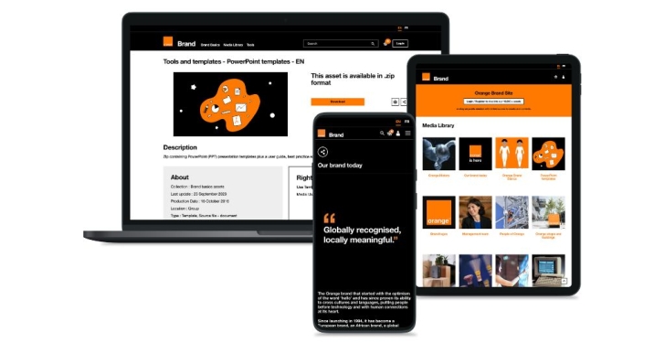 Brand Orange’s new website is shown on a laptop, phone and tablet