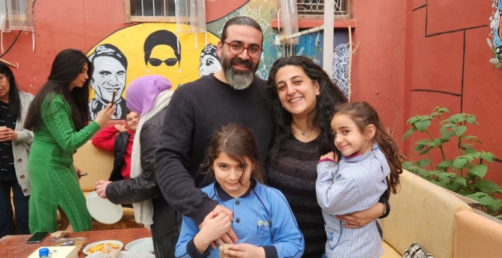 Layal Khatib and her family pose outside the Sikka community centre.