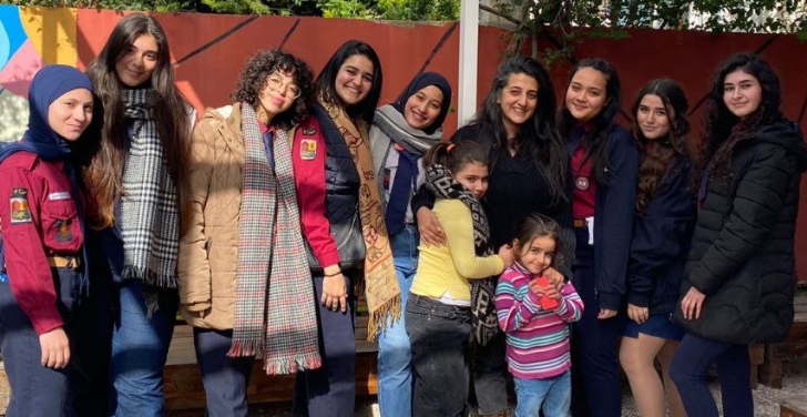 Layal Khatib poses with the group of girl scouts outside Sikka community centre.