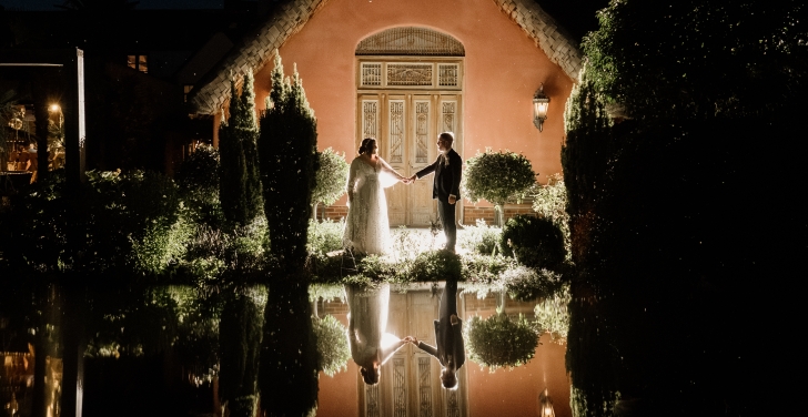 Tony Barker and his wife Sophie hold hands outside their wedding venue.