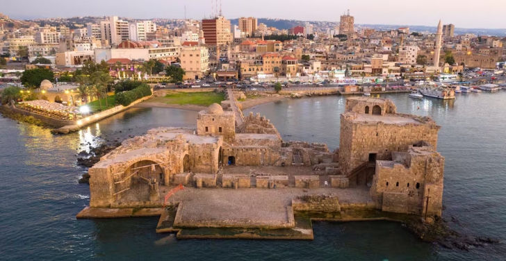 The Sidon Sea Castle foregrounds an aerial shot of Saida.