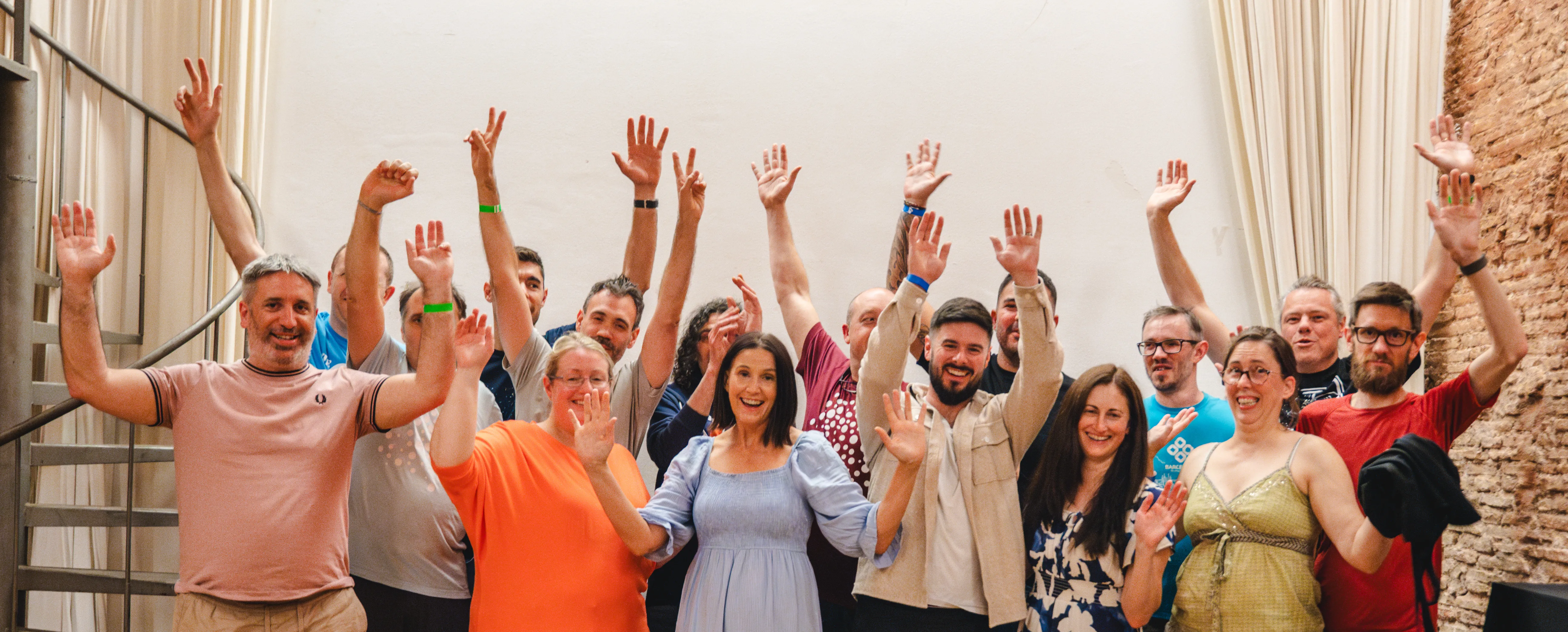 Team Annertech raise their hands in celebration at Born to Cook in Barcelona.